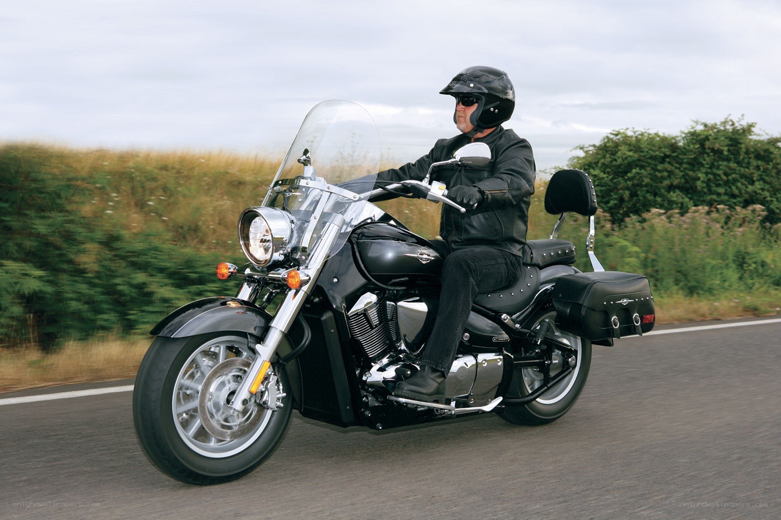 Man riding a motorcycle on road