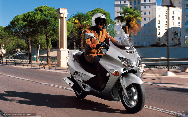 Man riding a scooter in the city