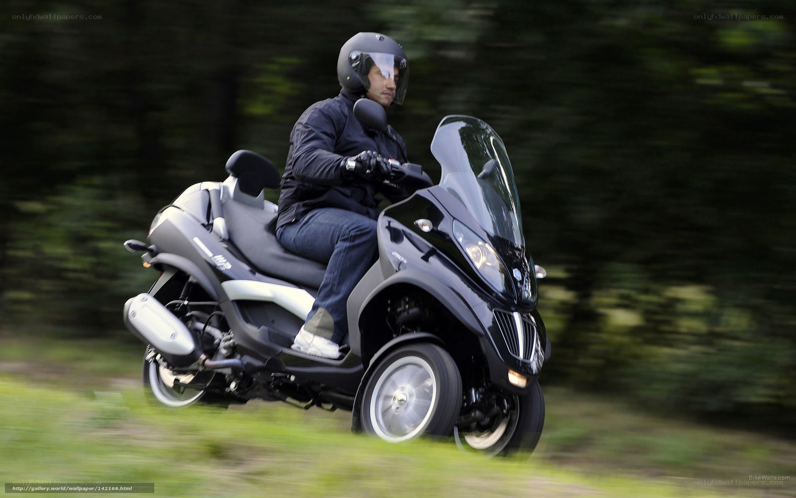 man riding a scooter
