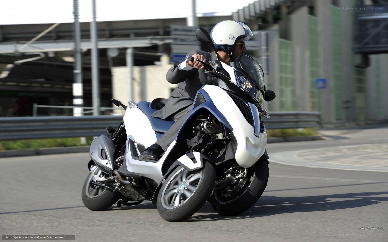man riding a three-wheeled motorcycle