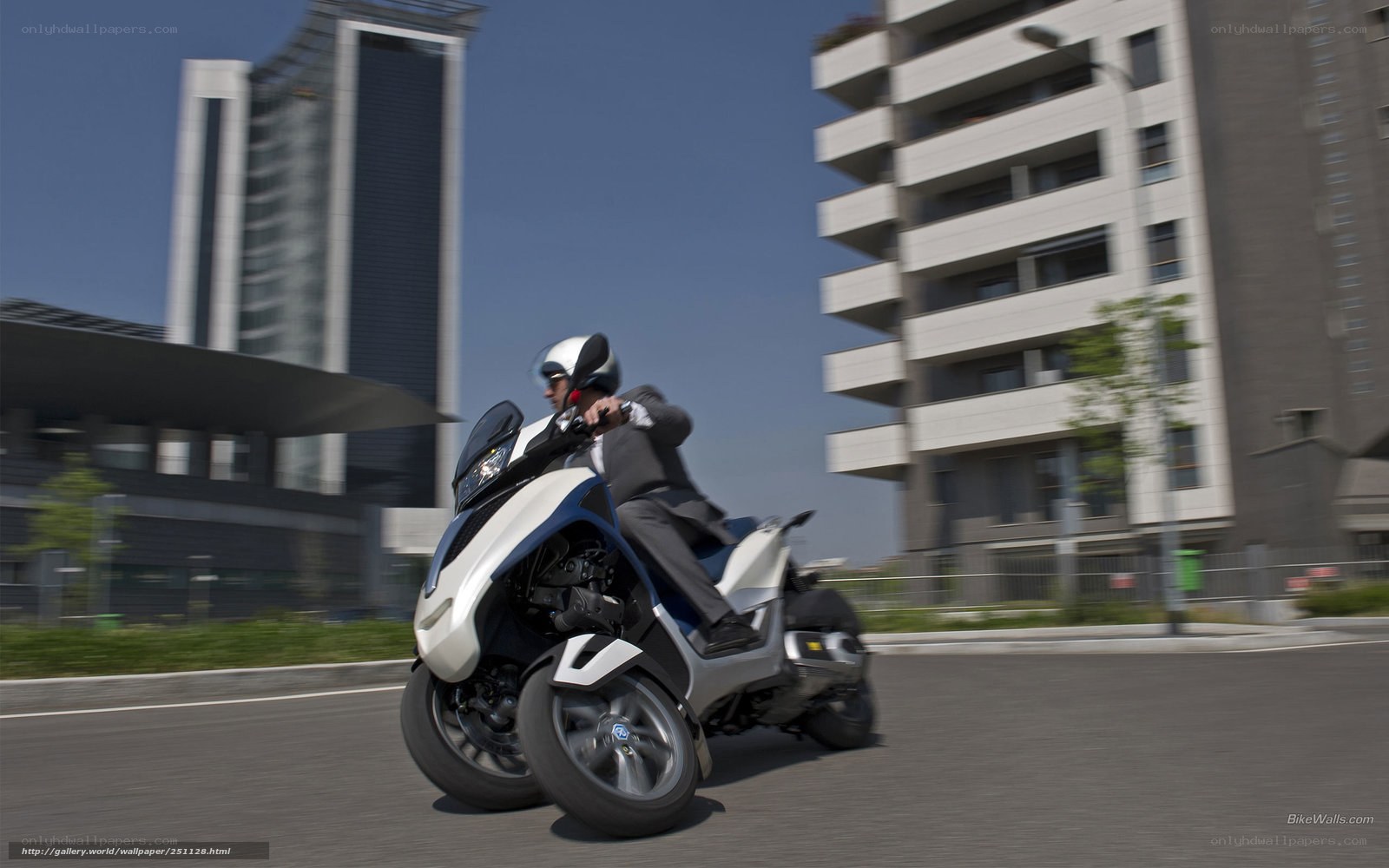 Man riding a three-wheeled scooter