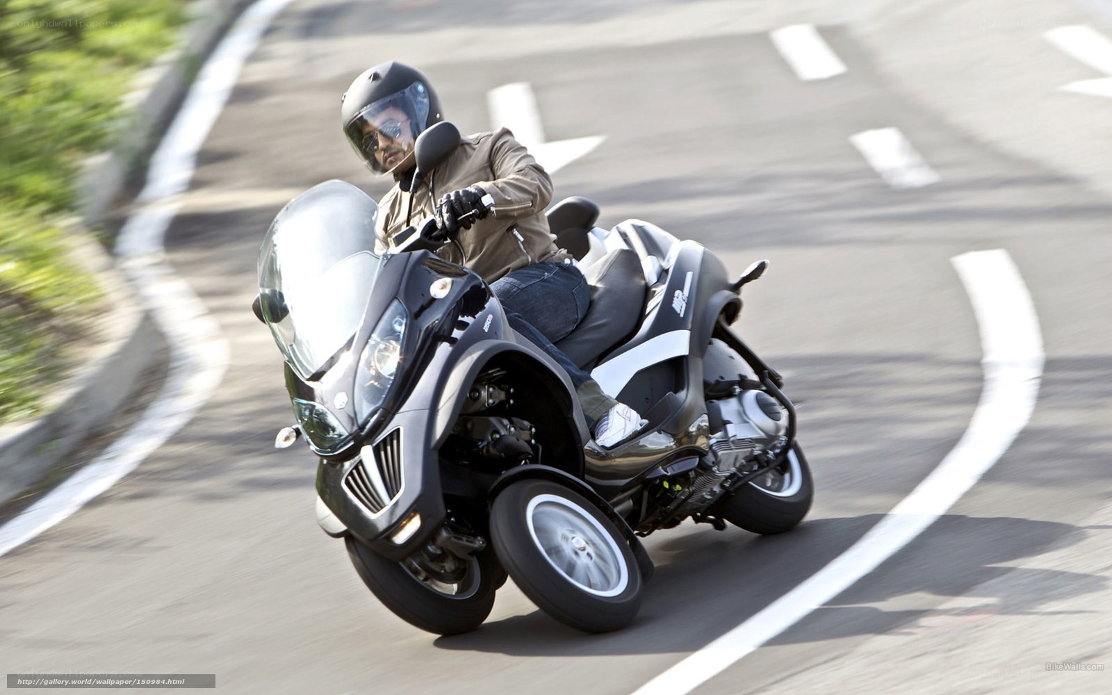 Man riding a three-wheeled scooter