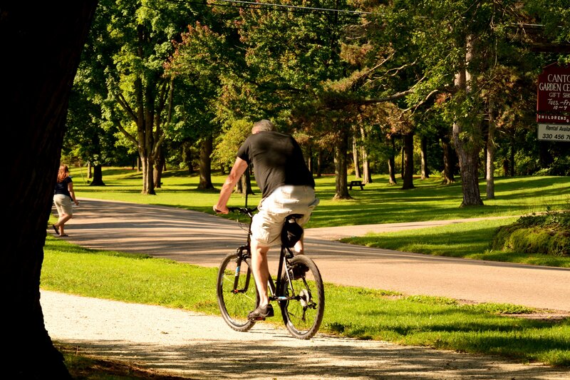 Man Riding Bicycle — Green, Serene