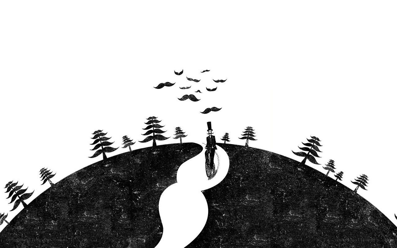 man riding bicycle on hill
