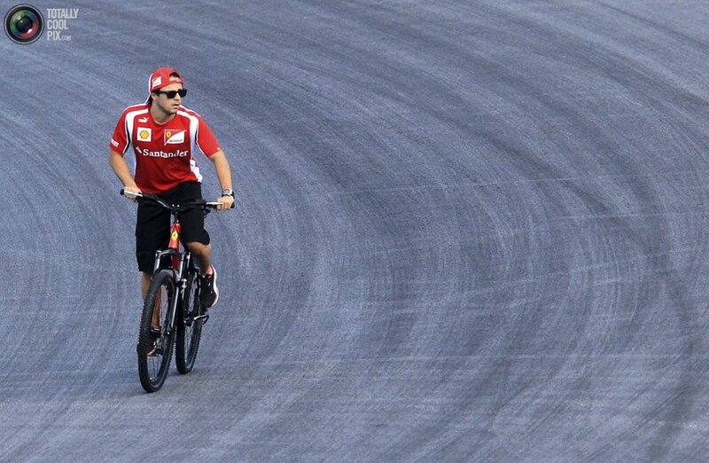 Man riding bike on racetrack