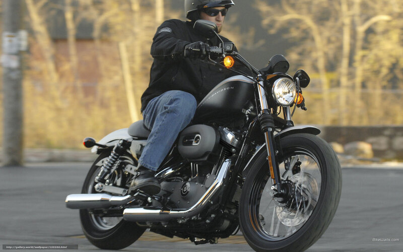 man riding black motorcycle