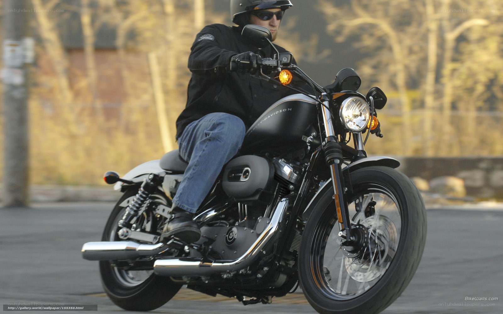 man riding black motorcycle