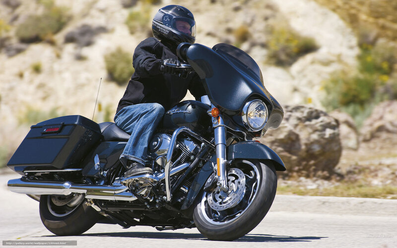 man riding black motorcycle