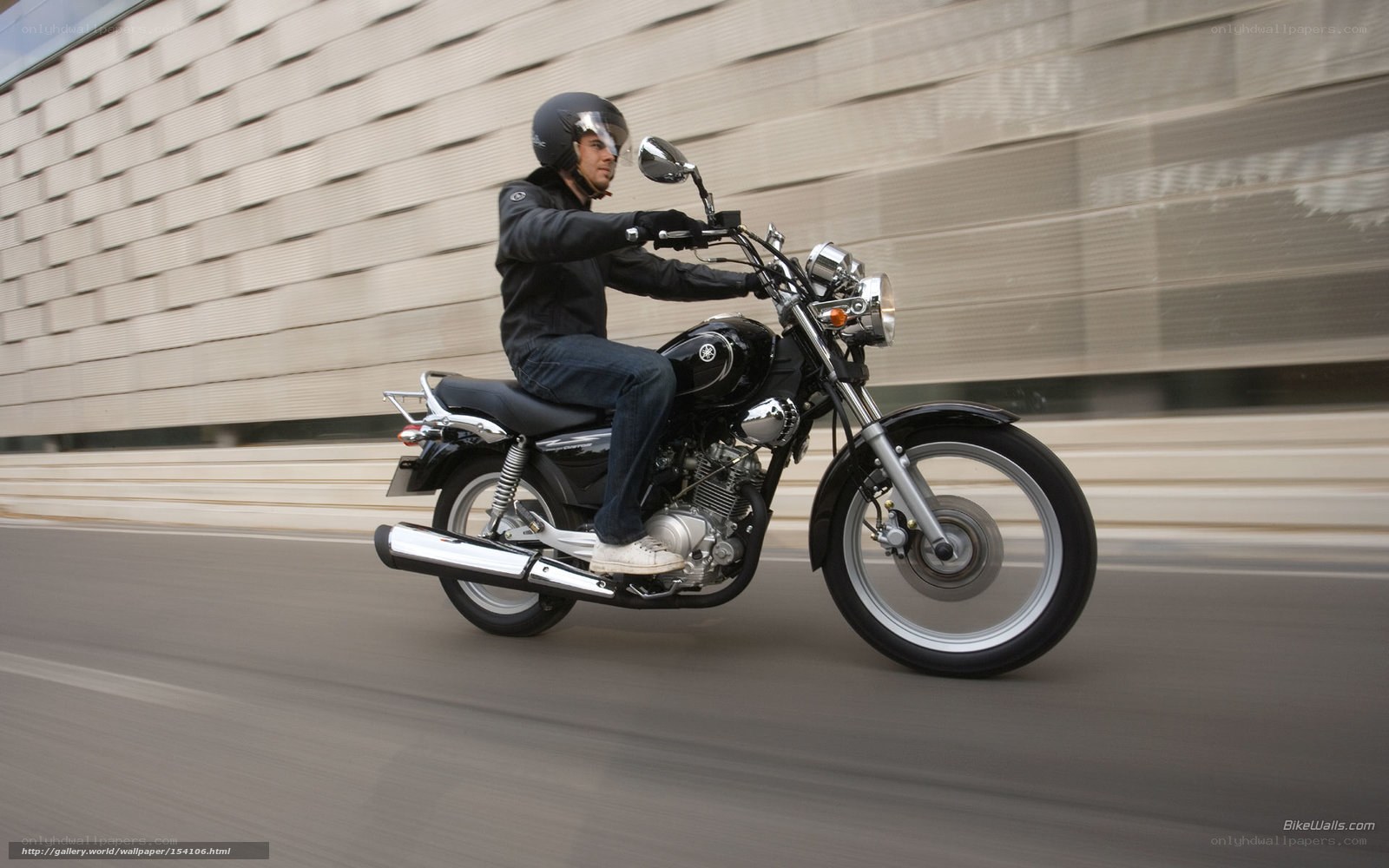 man riding black motorcycle