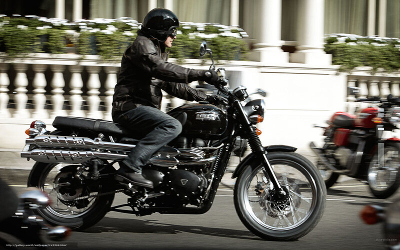 Man riding black motorcycle