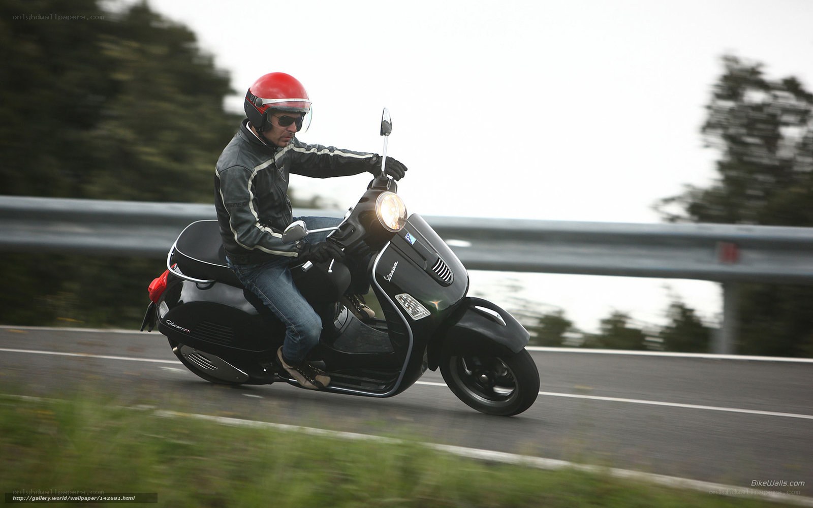 Man riding black scooter