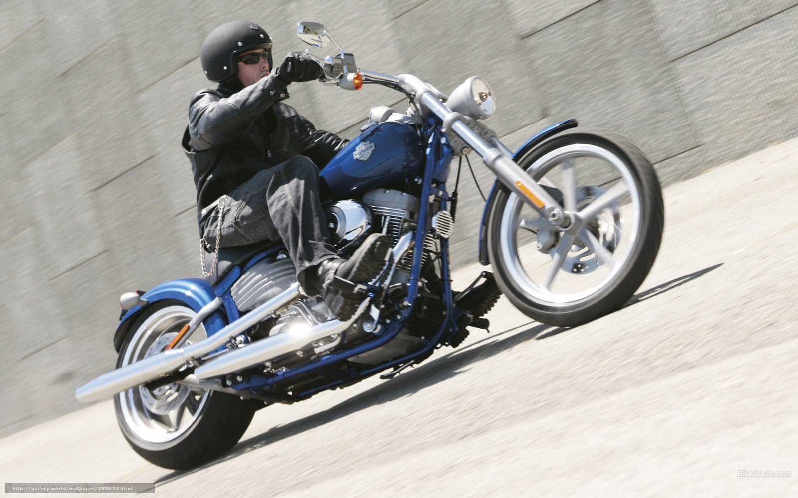 man riding blue motorcycle