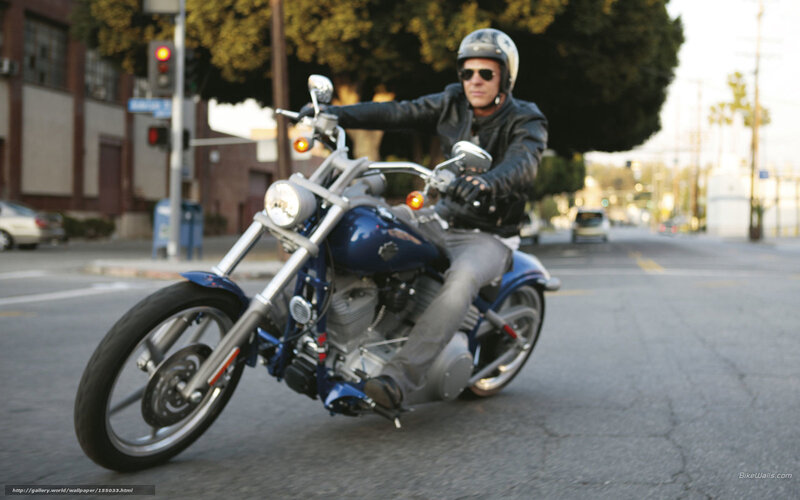 Man Riding Blue Motorcycle — Dynamic, Afternoon