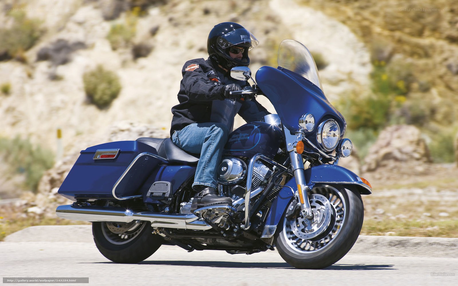 man riding blue motorcycle