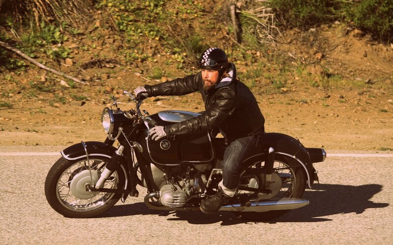 Man riding classic motorcycle