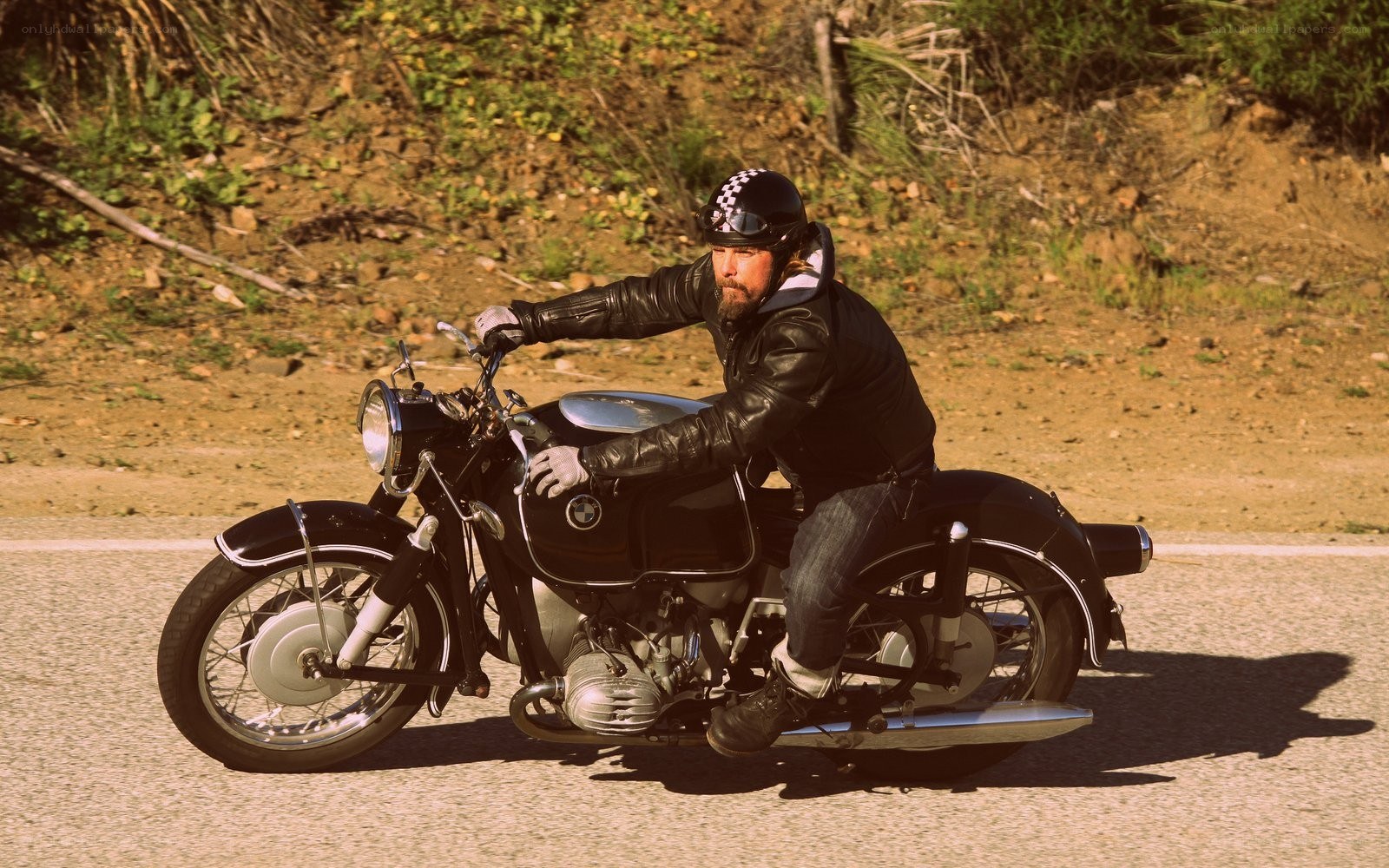 Man riding classic motorcycle