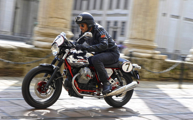 Man riding classic motorcycle