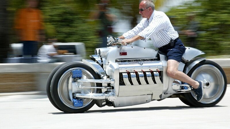 man riding custom motorcycle