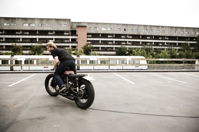 Man riding custom motorcycle