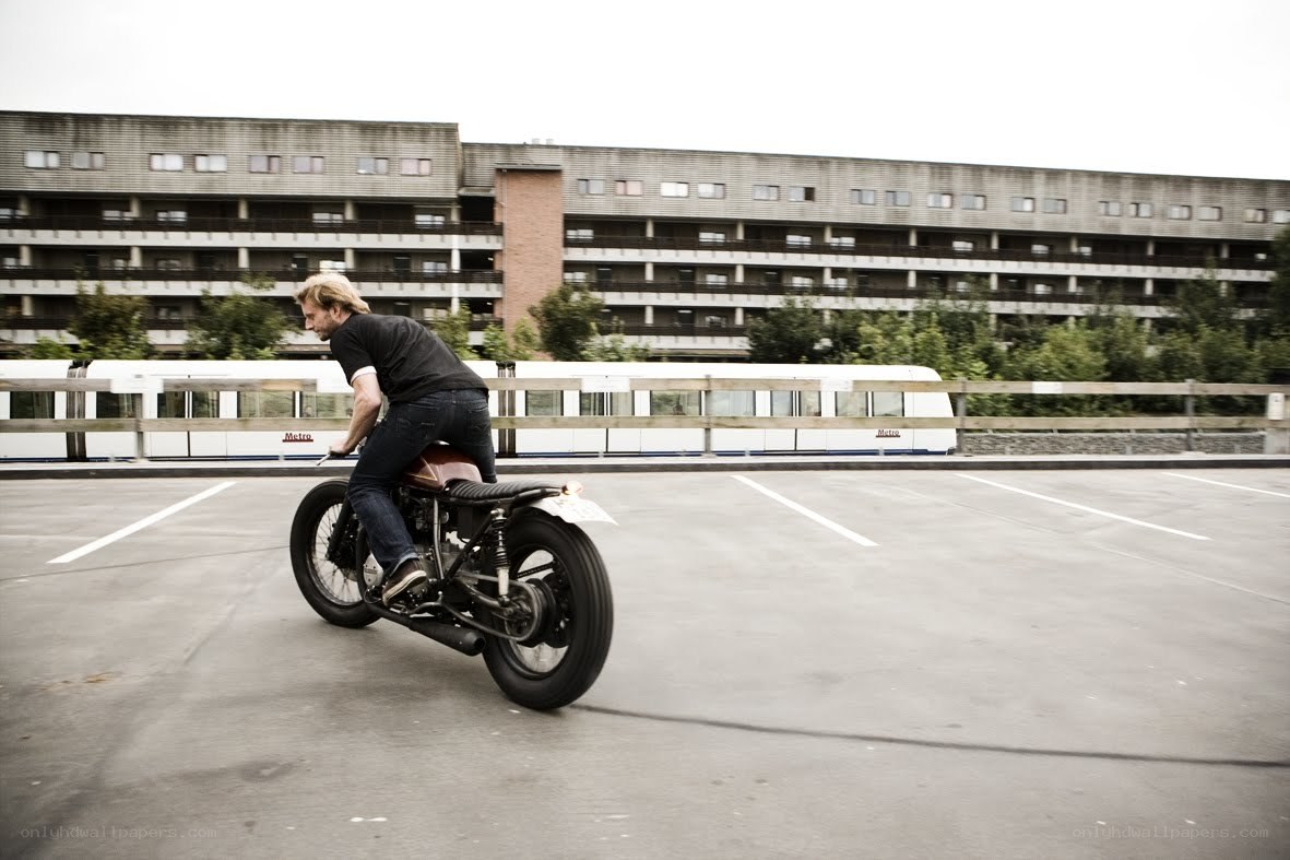 Man riding custom motorcycle