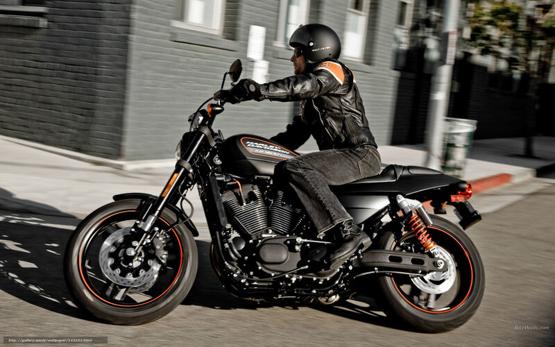 man riding harley motorcycle