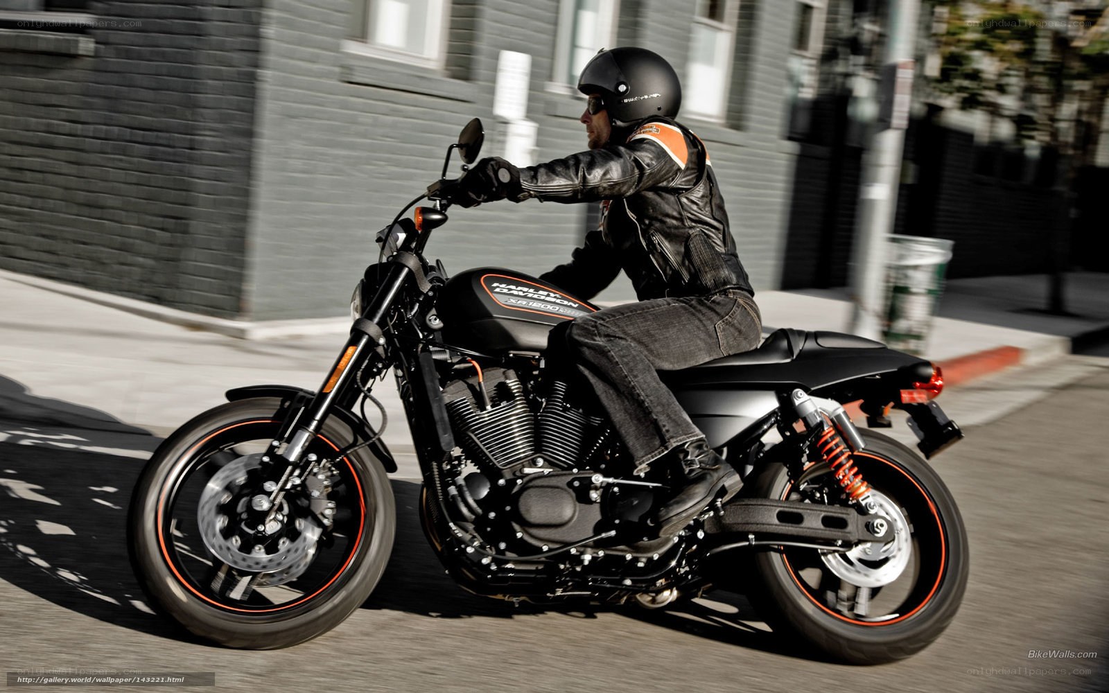 man riding harley motorcycle