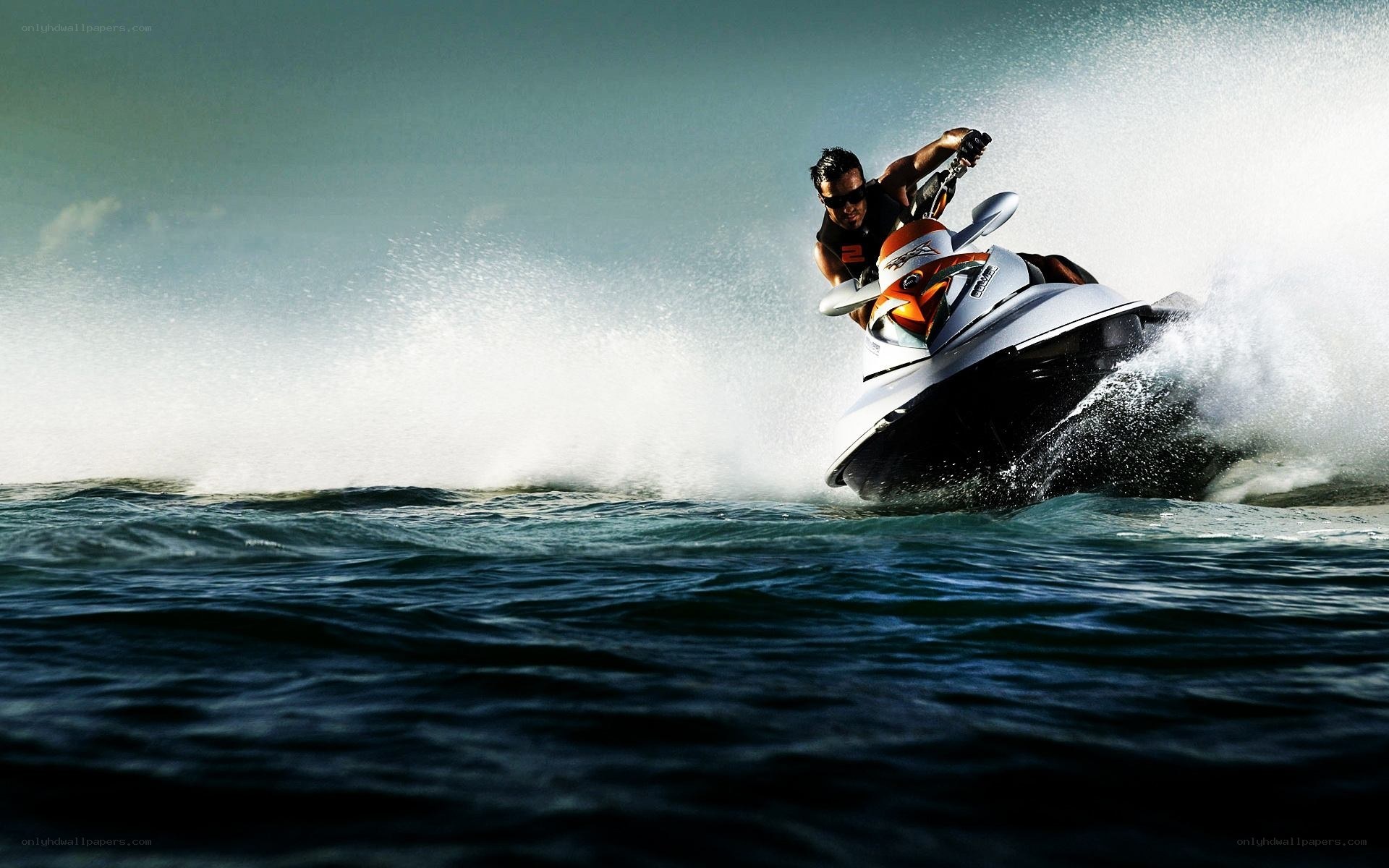 Man riding jet ski on ocean