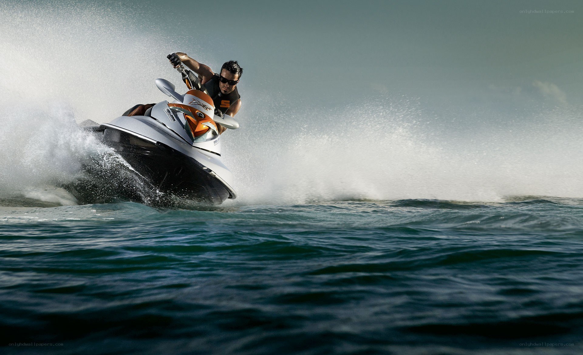 Man riding jet ski on ocean