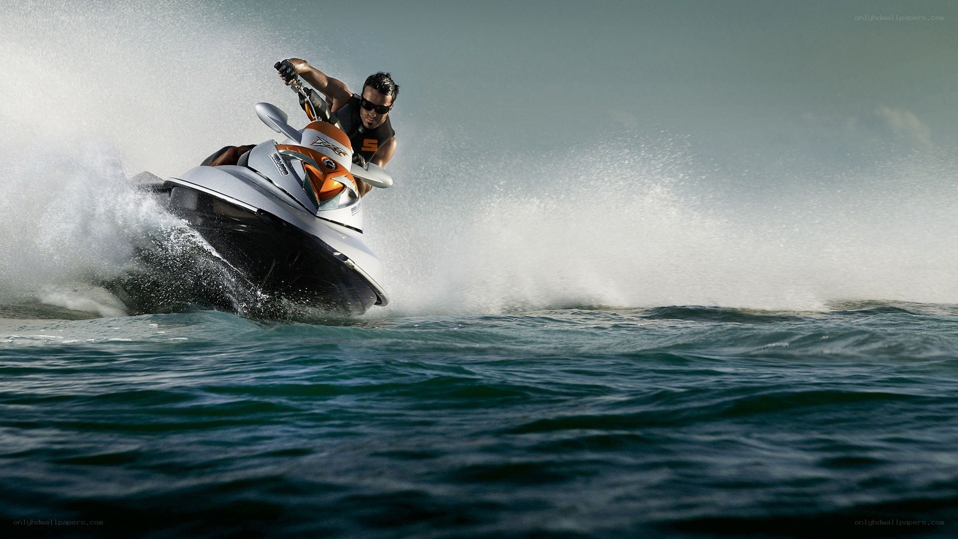 Man riding jet ski on ocean