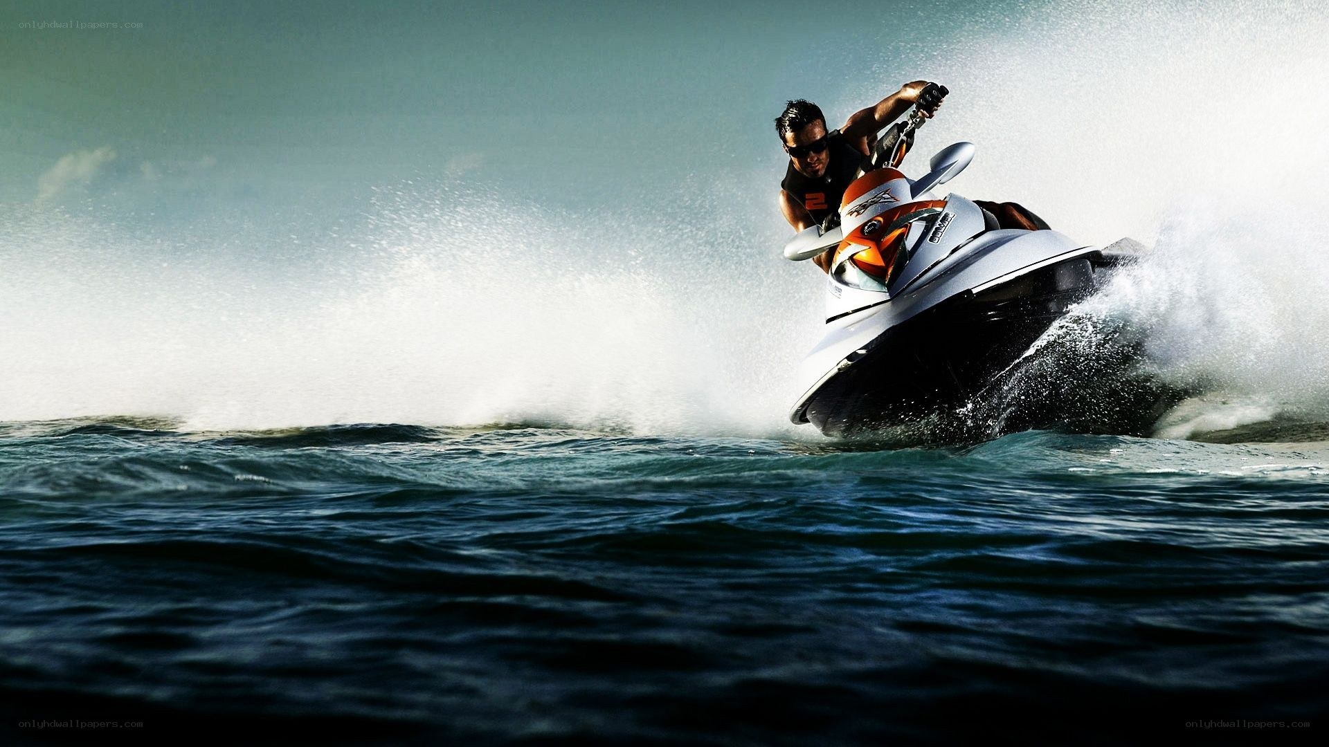 Man riding jet ski on ocean