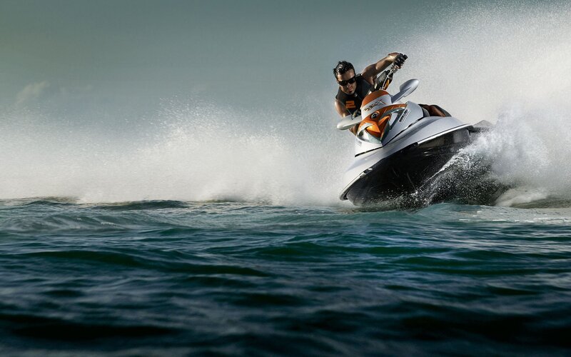 Man riding jet ski on ocean