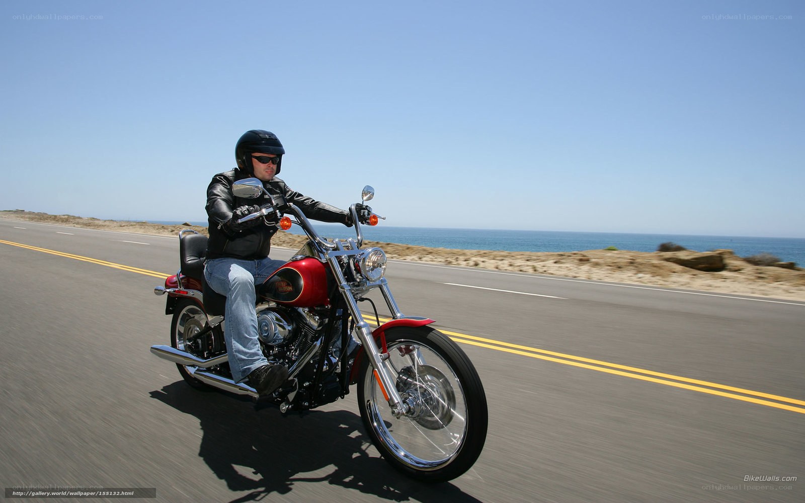 Man riding motorcycle on coastal road