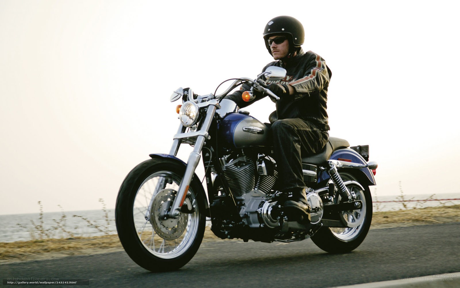 Man riding motorcycle on coastal road