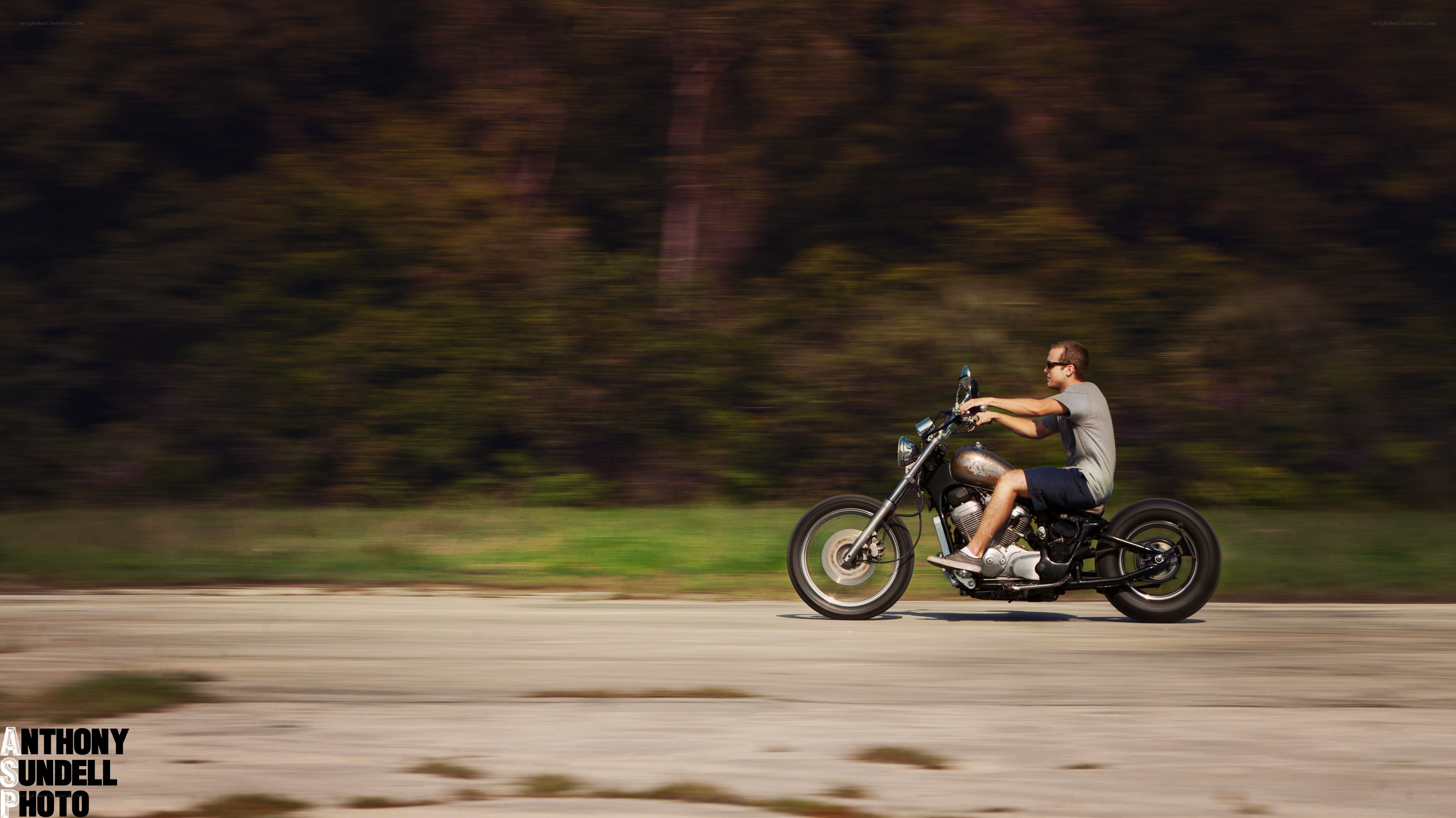 Man riding motorcycle on road