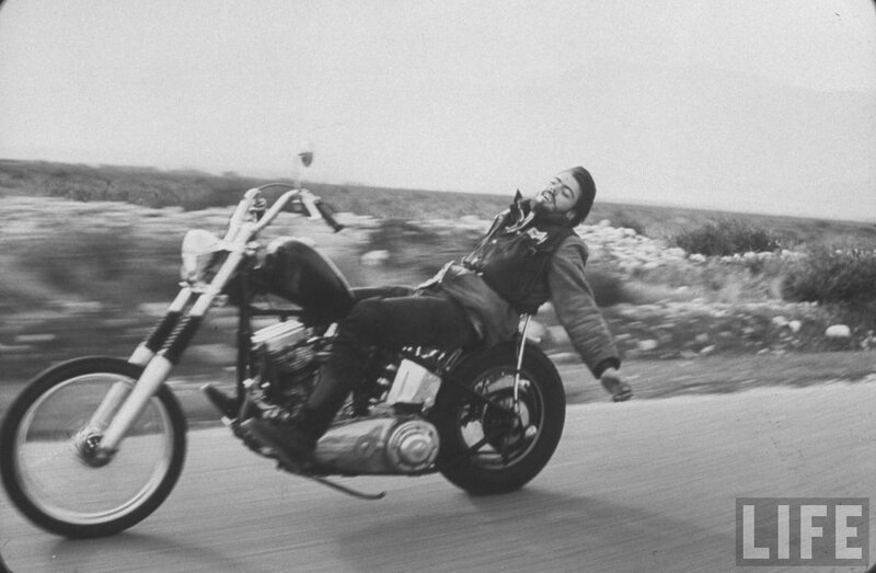 Man riding motorcycle on road