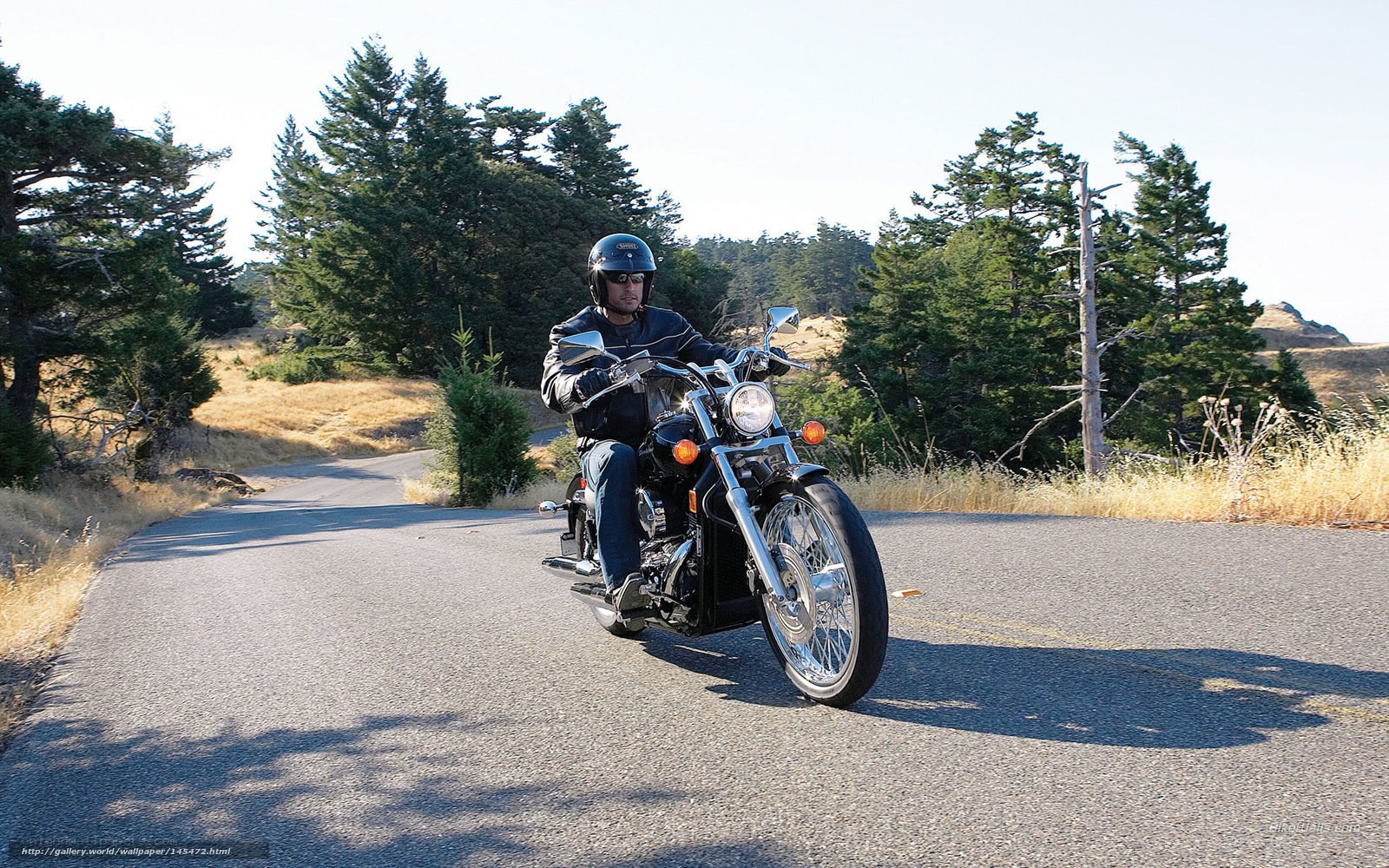 Man riding motorcycle on road