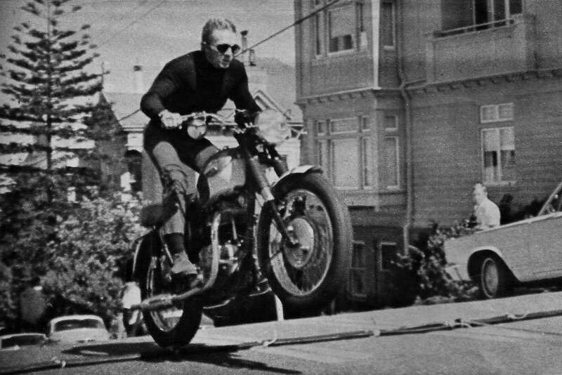 Man riding motorcycle on street