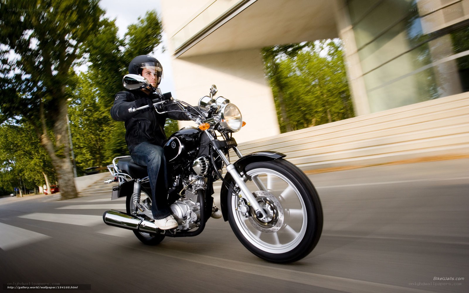 man riding motorcycle on street