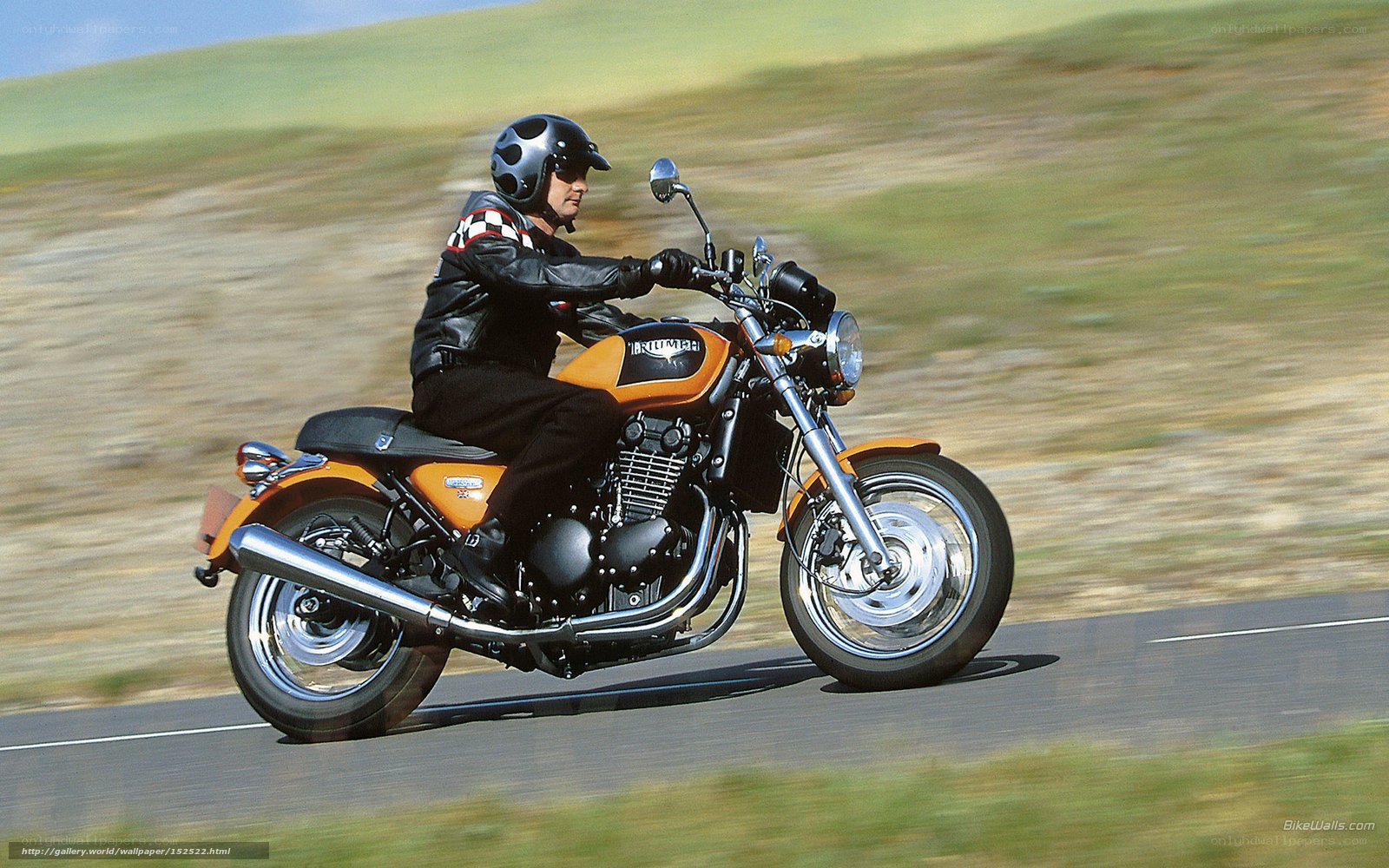 man riding orange motorcycle