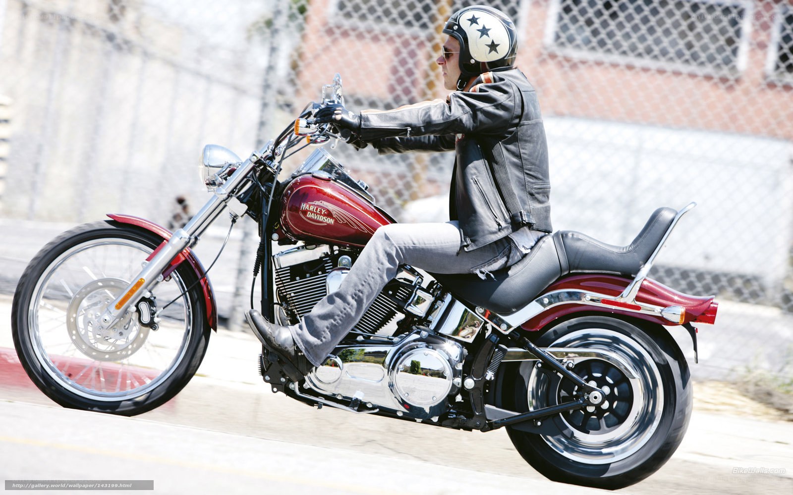 Man riding red motorcycle