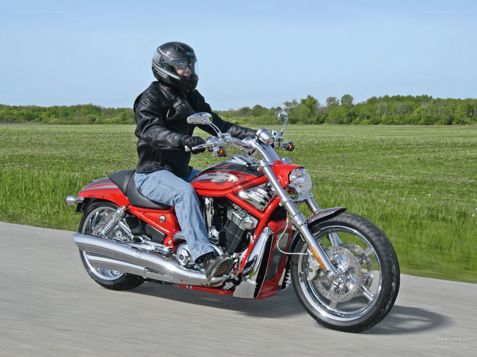 Man riding red motorcycle