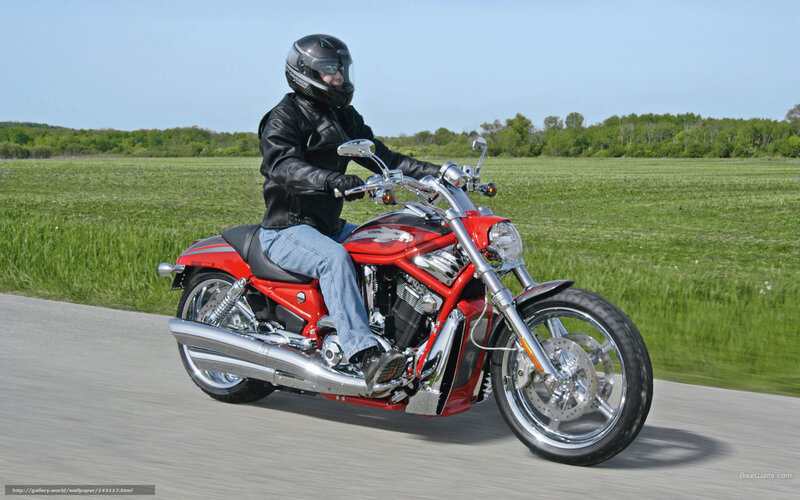 Man riding red motorcycle