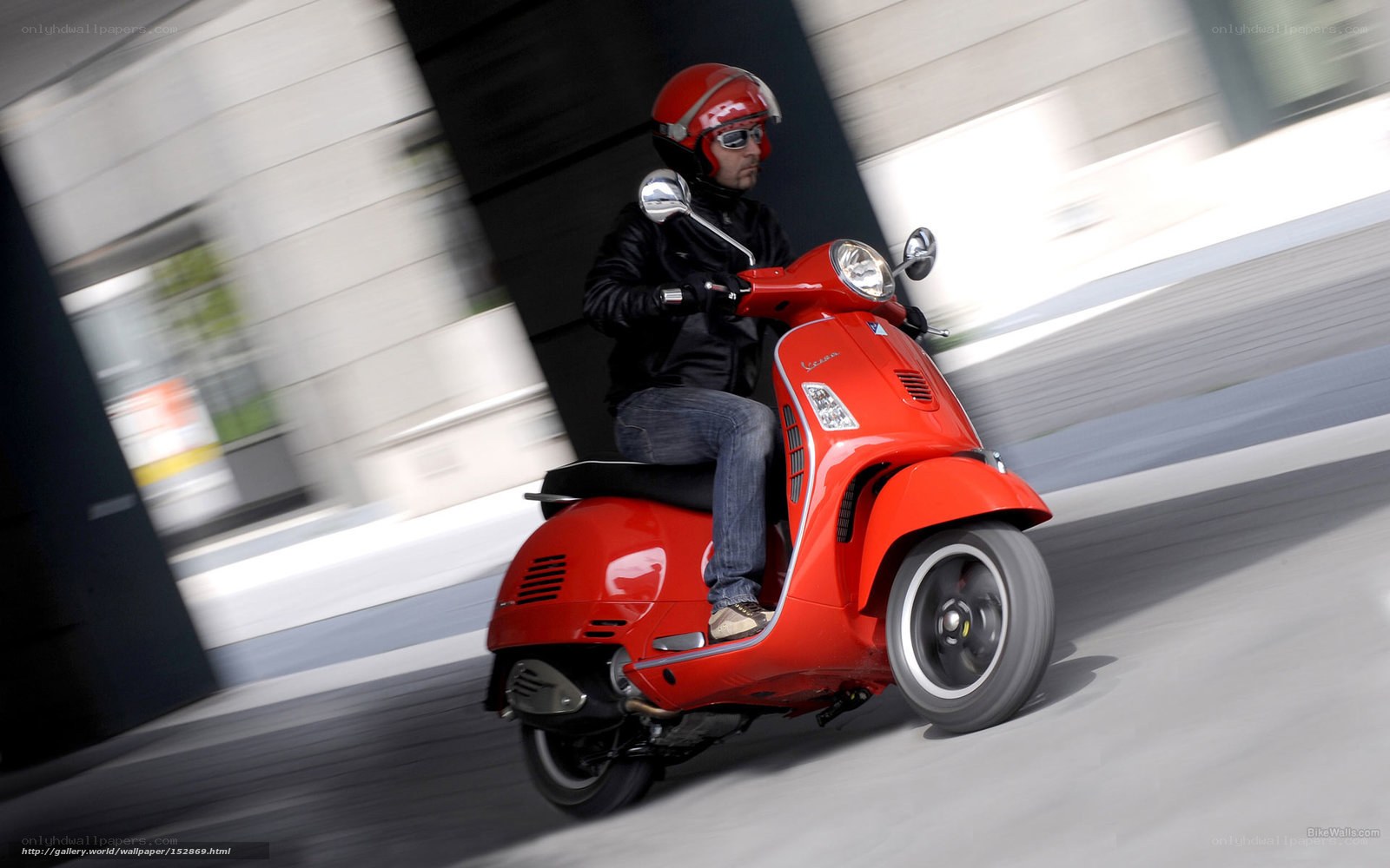 Man riding red scooter