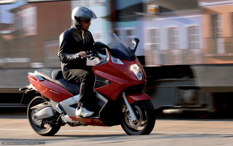 Man Riding Red Scooter — Dynamic, Afternoon, Photograph