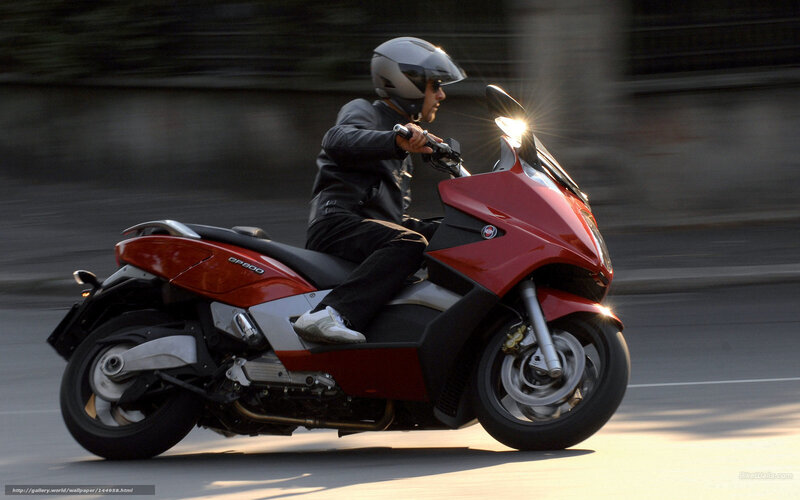 Man Riding Red Scooter — Dynamic, Sunset