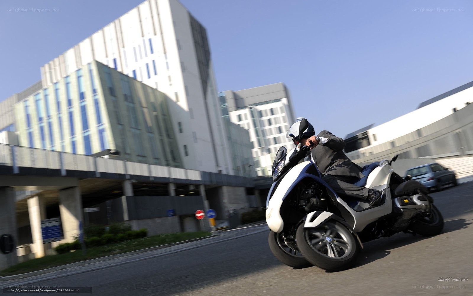 Man riding scooter in city
