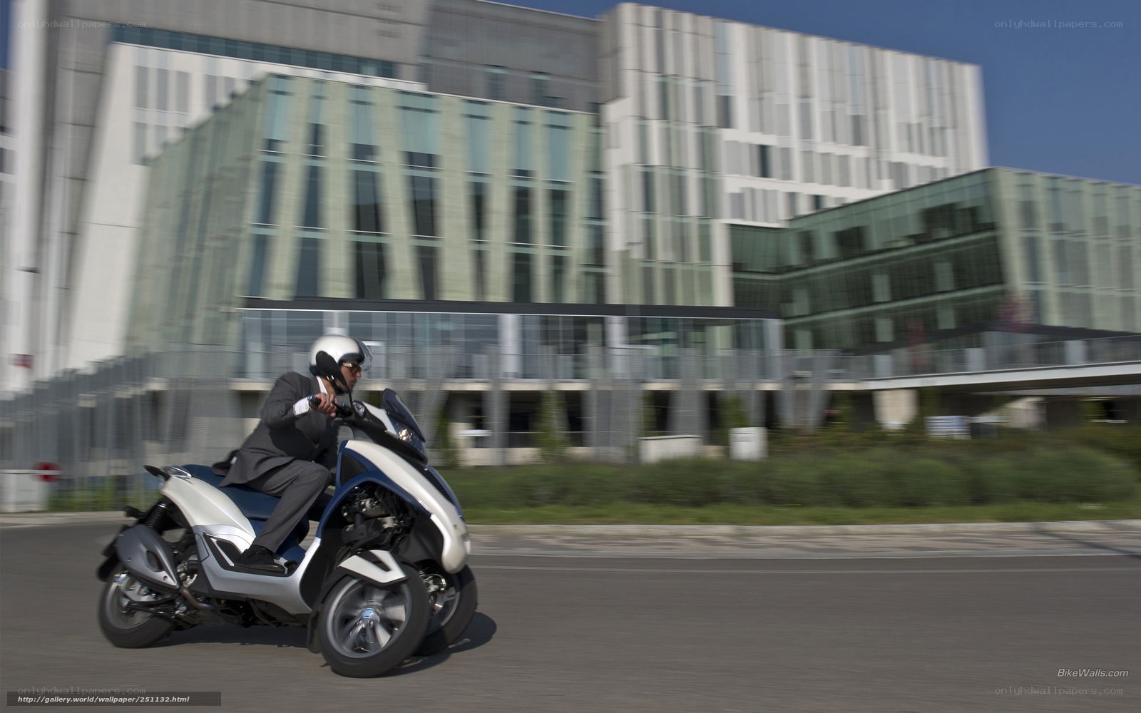 Man riding scooter in city