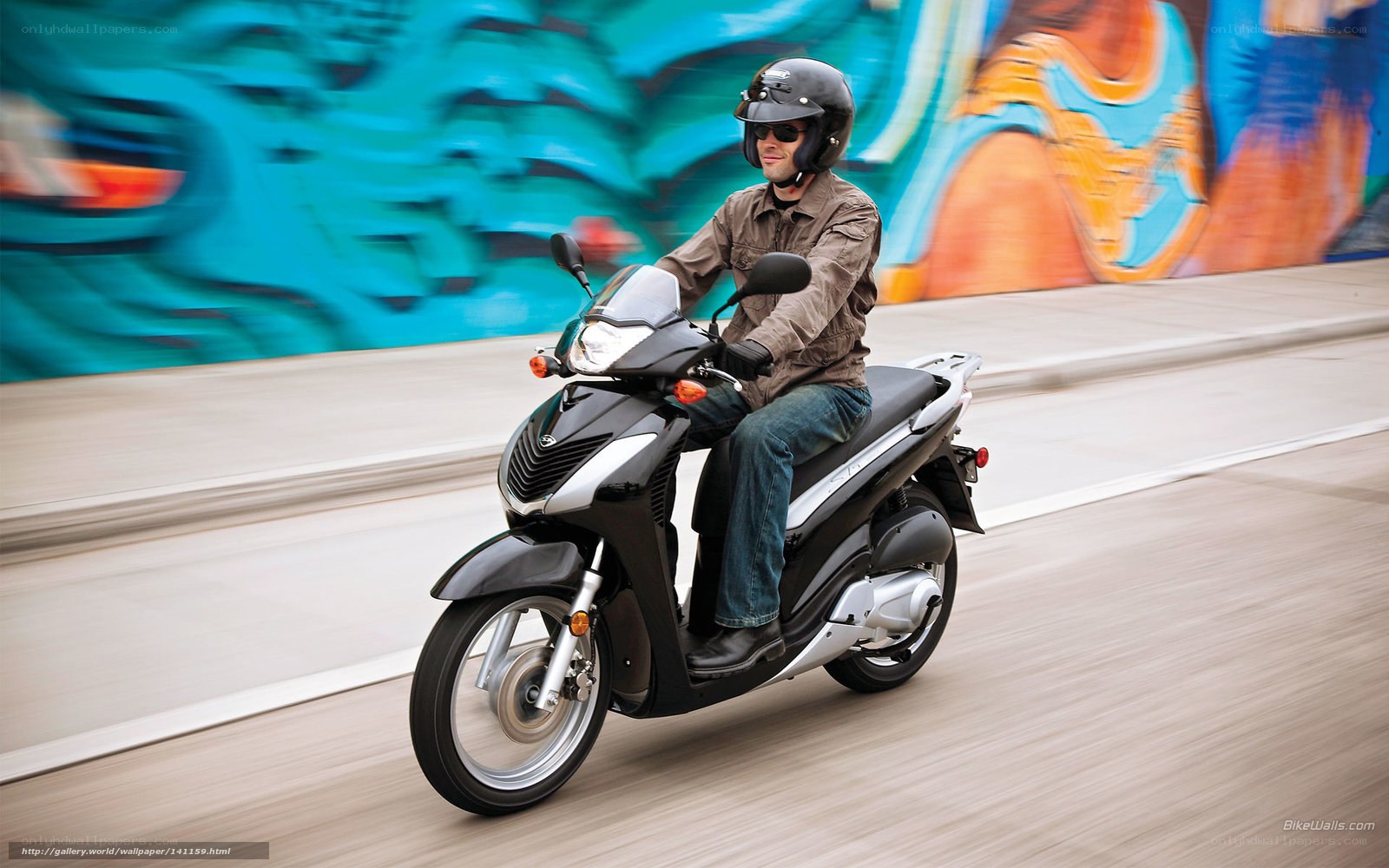Man riding scooter on city street