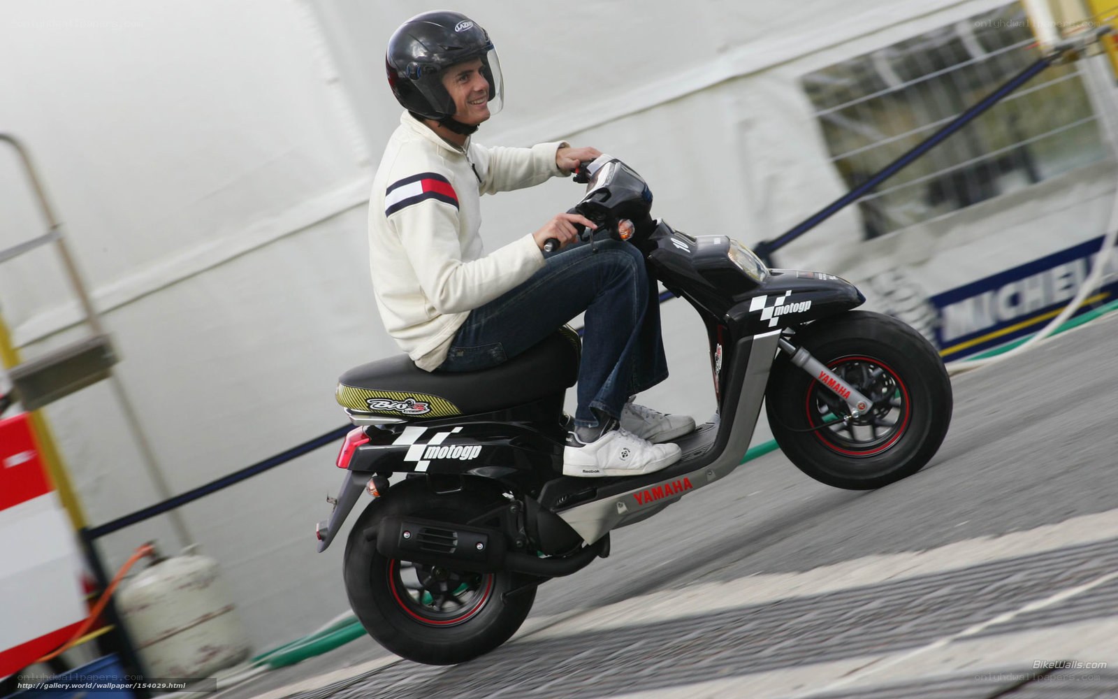 man riding scooter on ramp