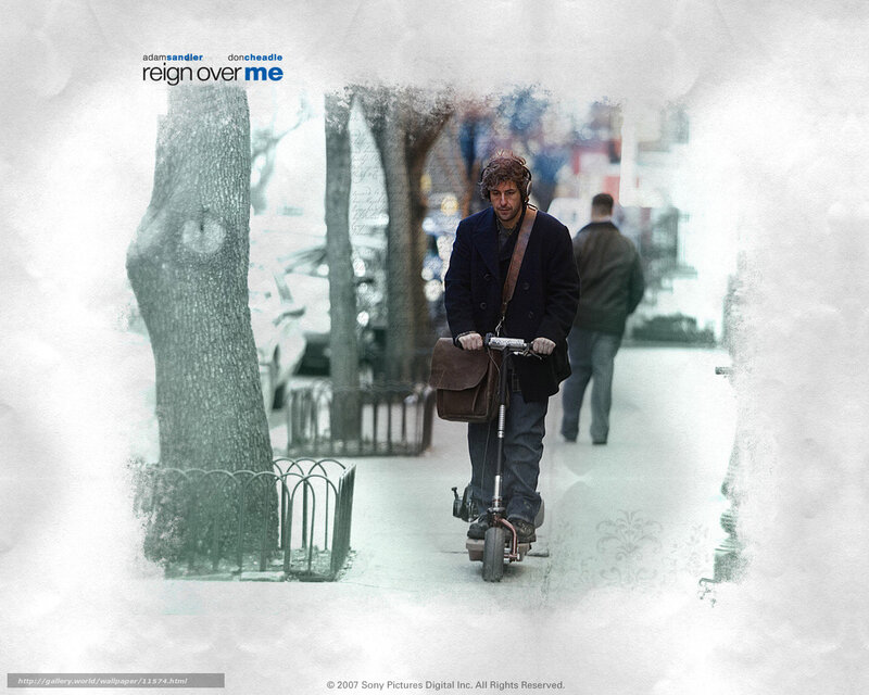 man riding scooter on sidewalk